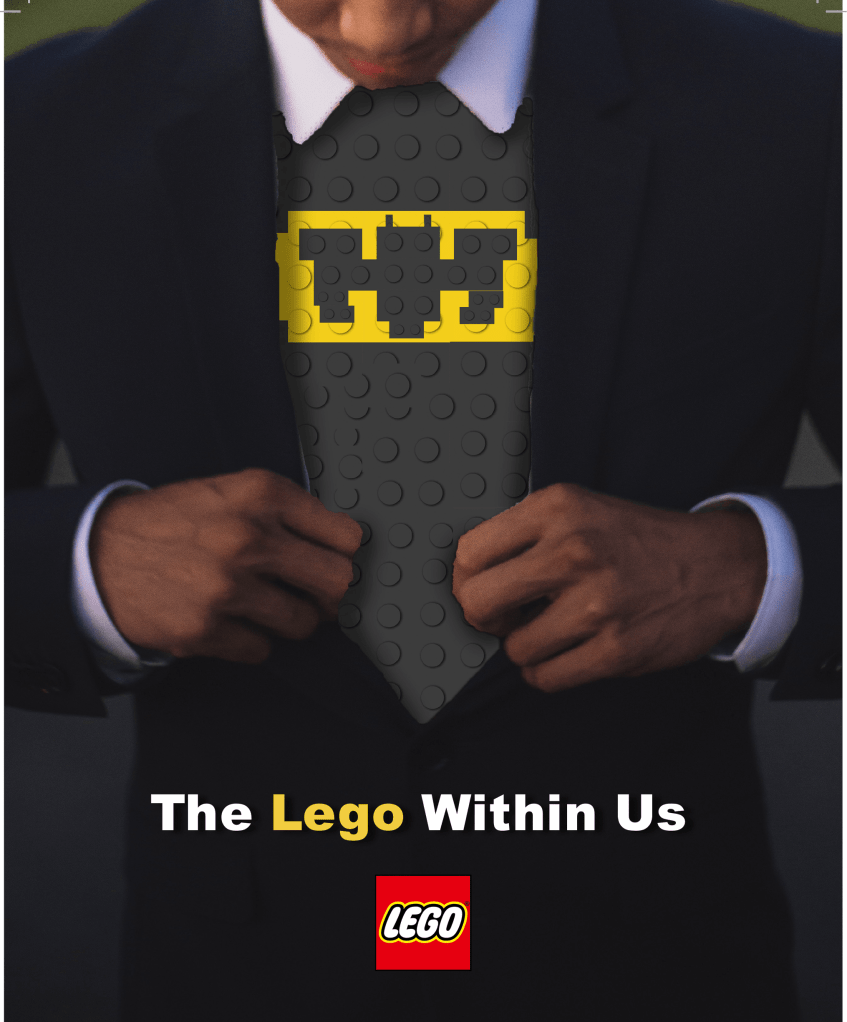 It is a Lego Billboard with the headline saying "The lego Within Us" and a man opening his suit revealing a batman lego superhero underneath.